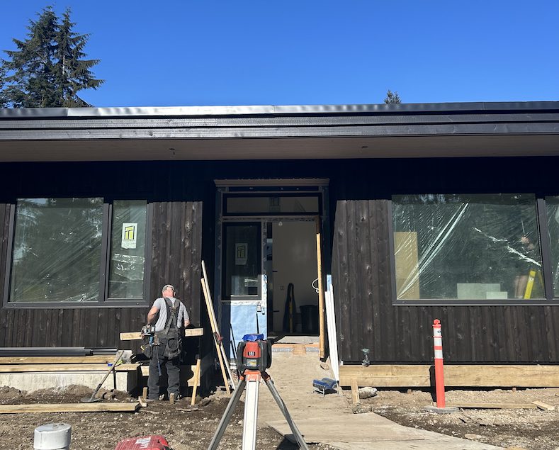 Hasler Homes team member working hard on construction site - demonstrating what to look for when wondering how to choose a home builder