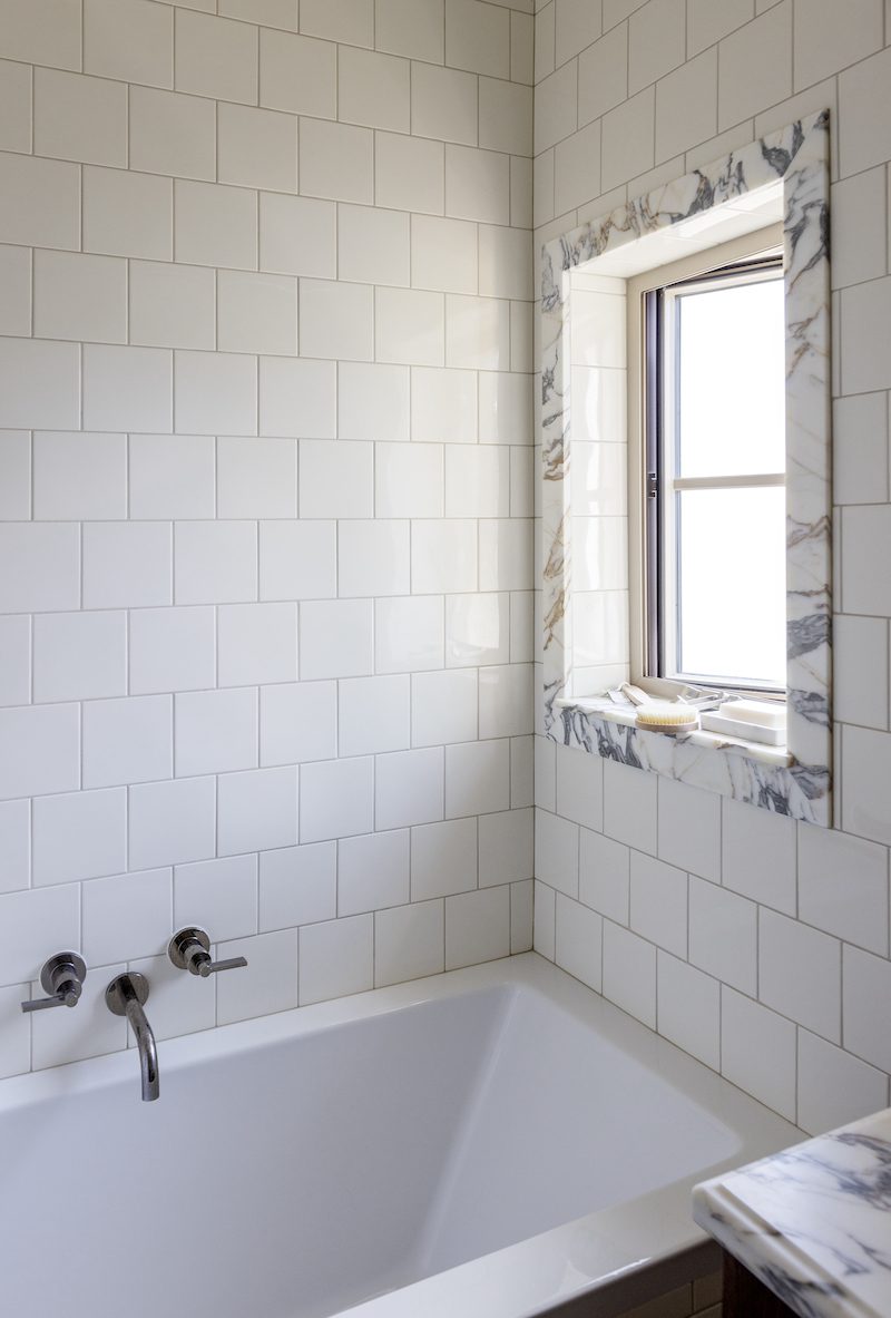 custom bathroom with a sweet farmhouse window with a unique marble trim