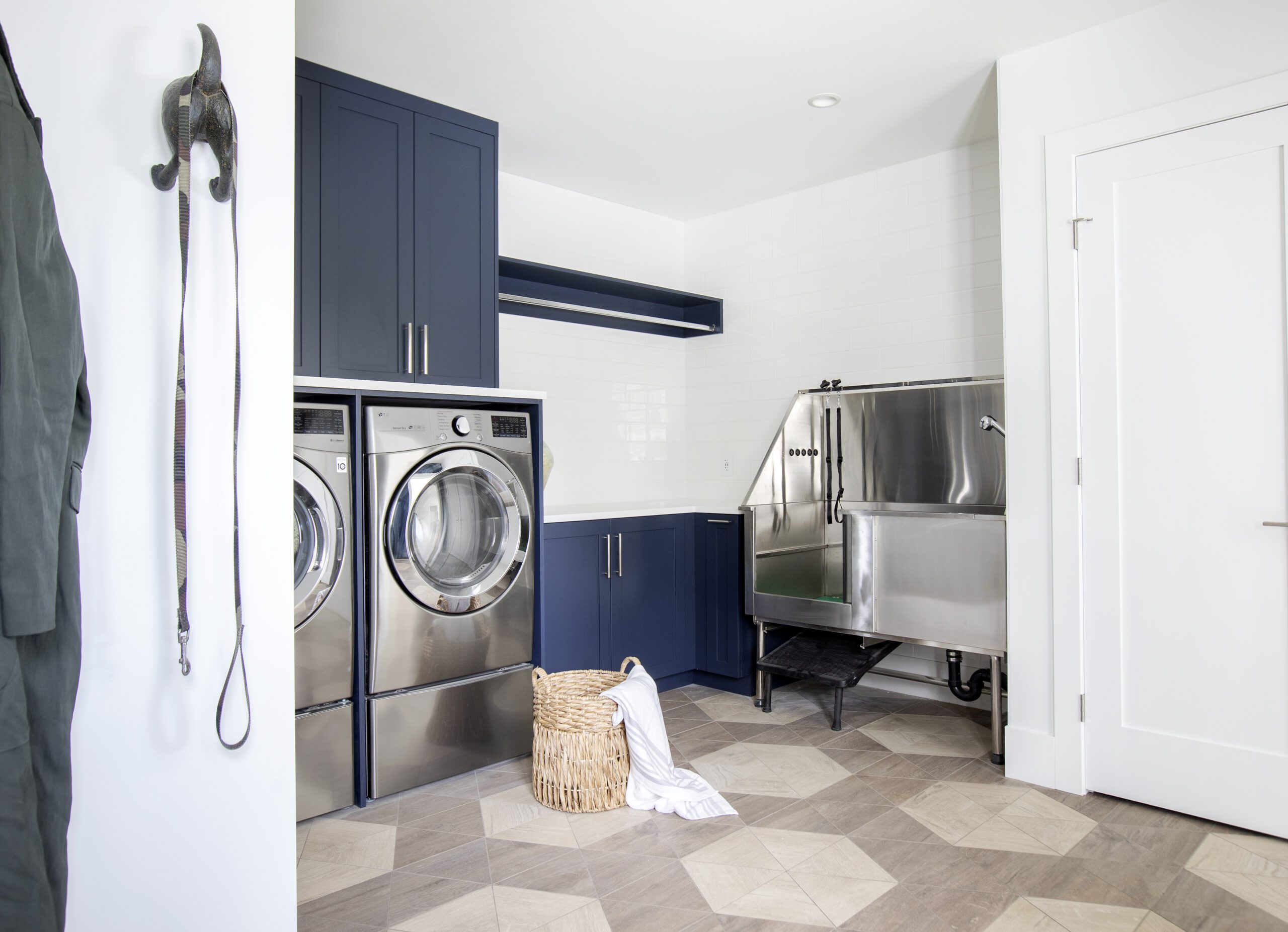 Main floor laundry room with dog wash in North Vancouver custom home built by Hasler Homes