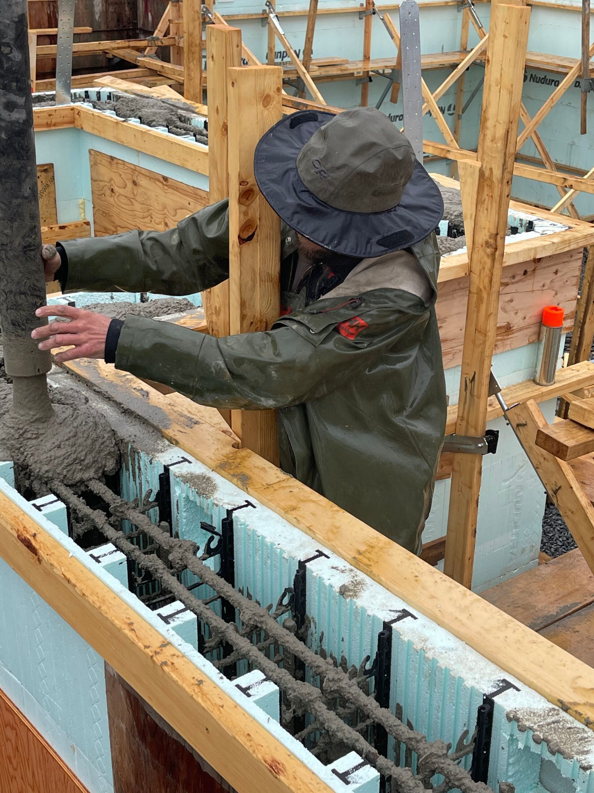 Hasler Homes employee pouring forms during winter renovation