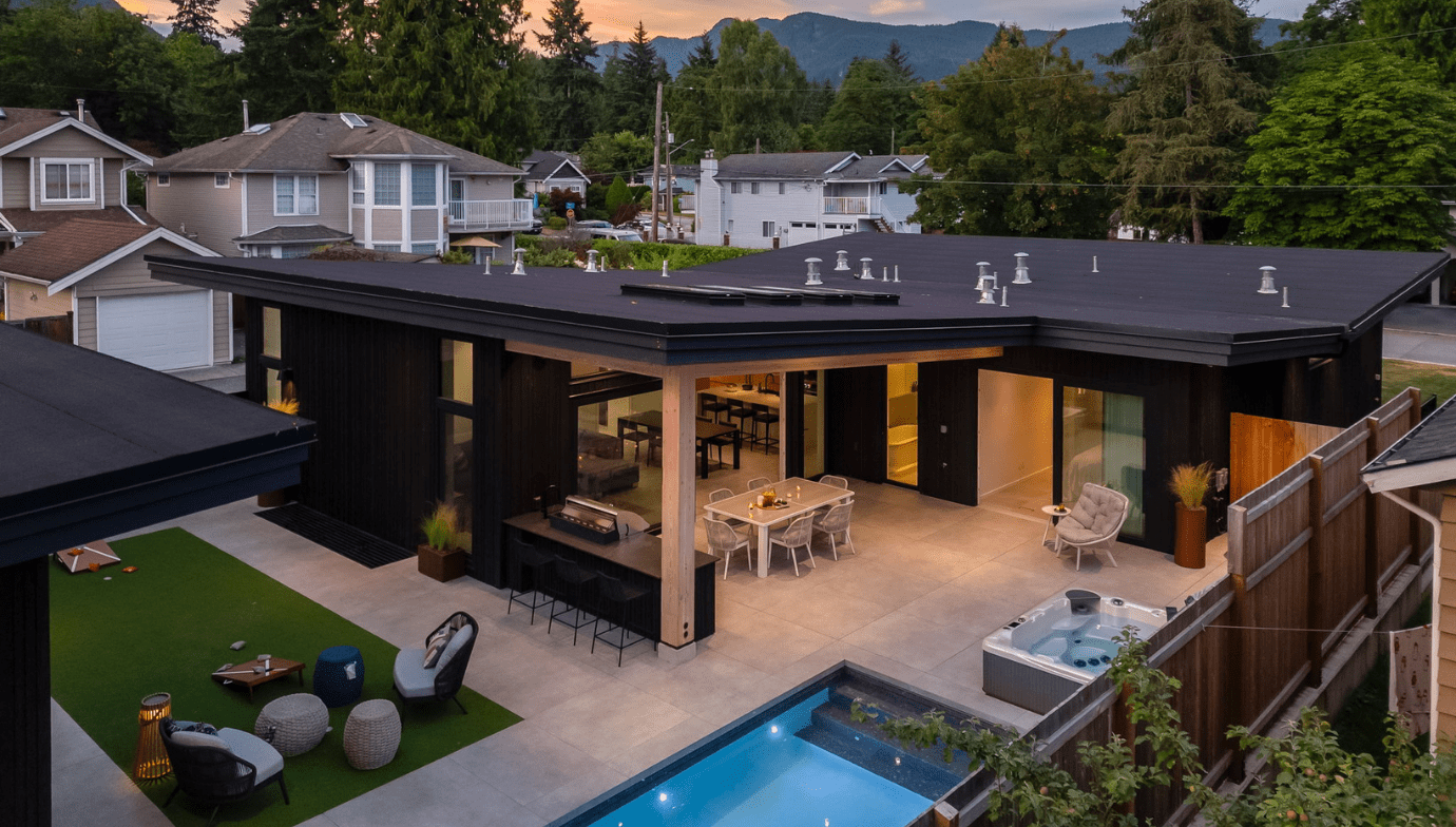 Valleyhouse custom home back exterior at dusk