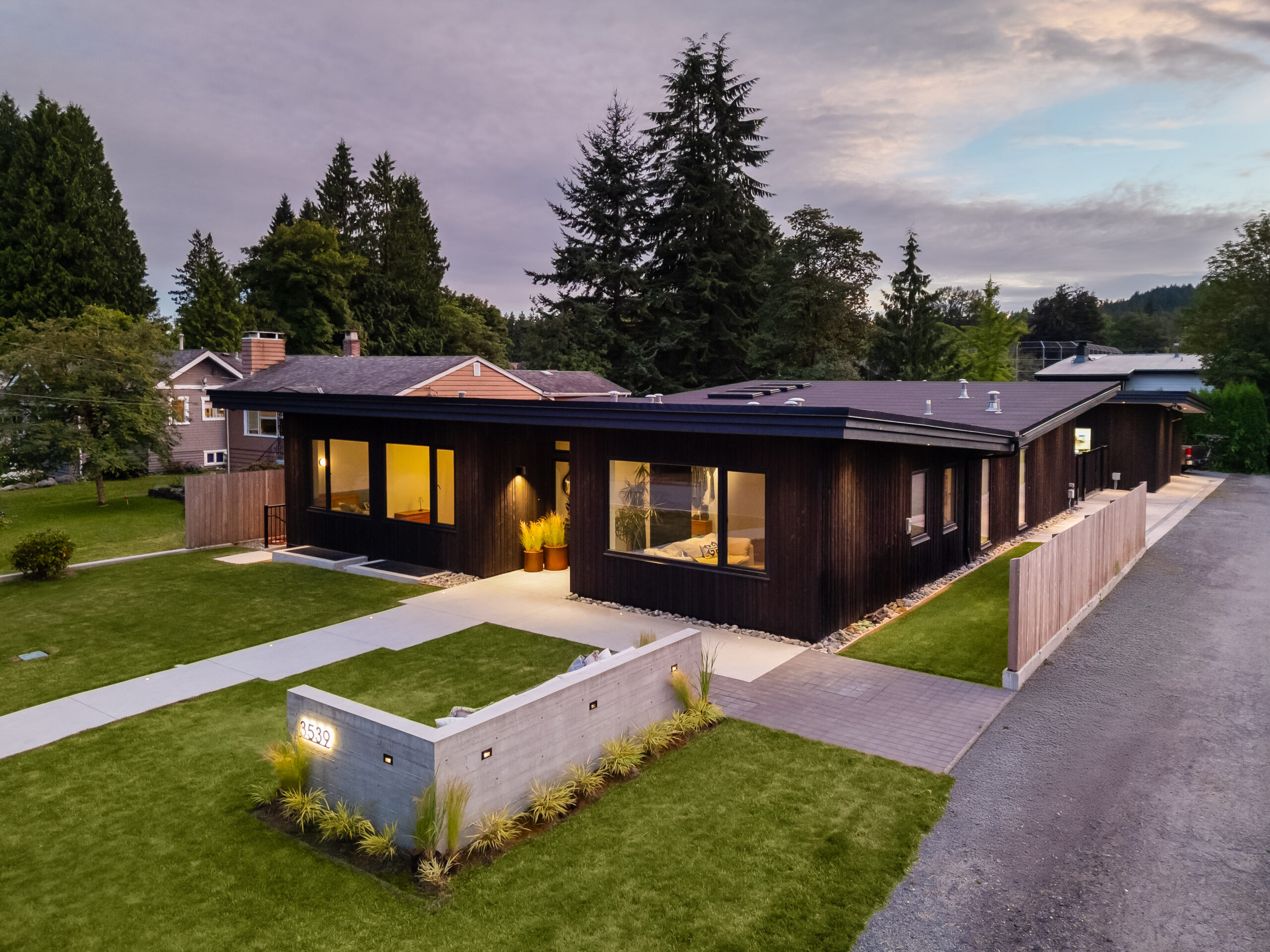 Valleyouse custom home in Lynn Valley, North Vancouver built by Hasler Homes - front exterior at dusk