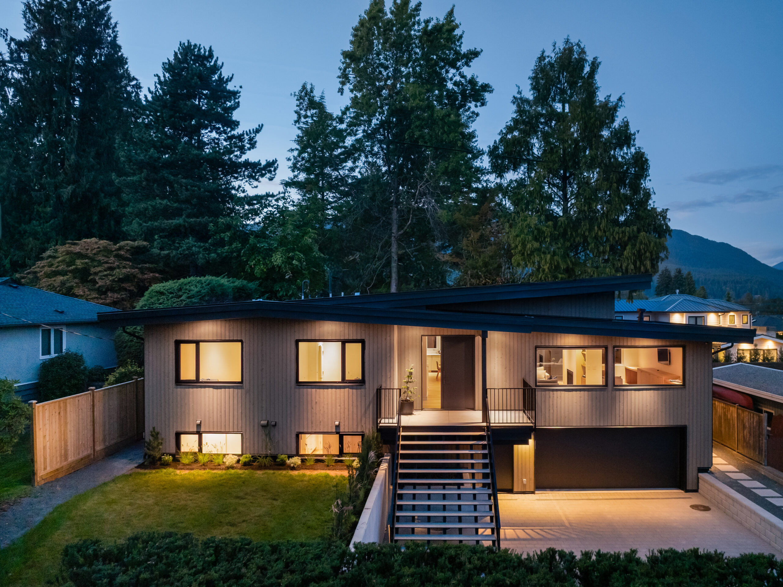 Brightwater home renovation in Deep Cove, North Vancouver - front exterior of house at dusk