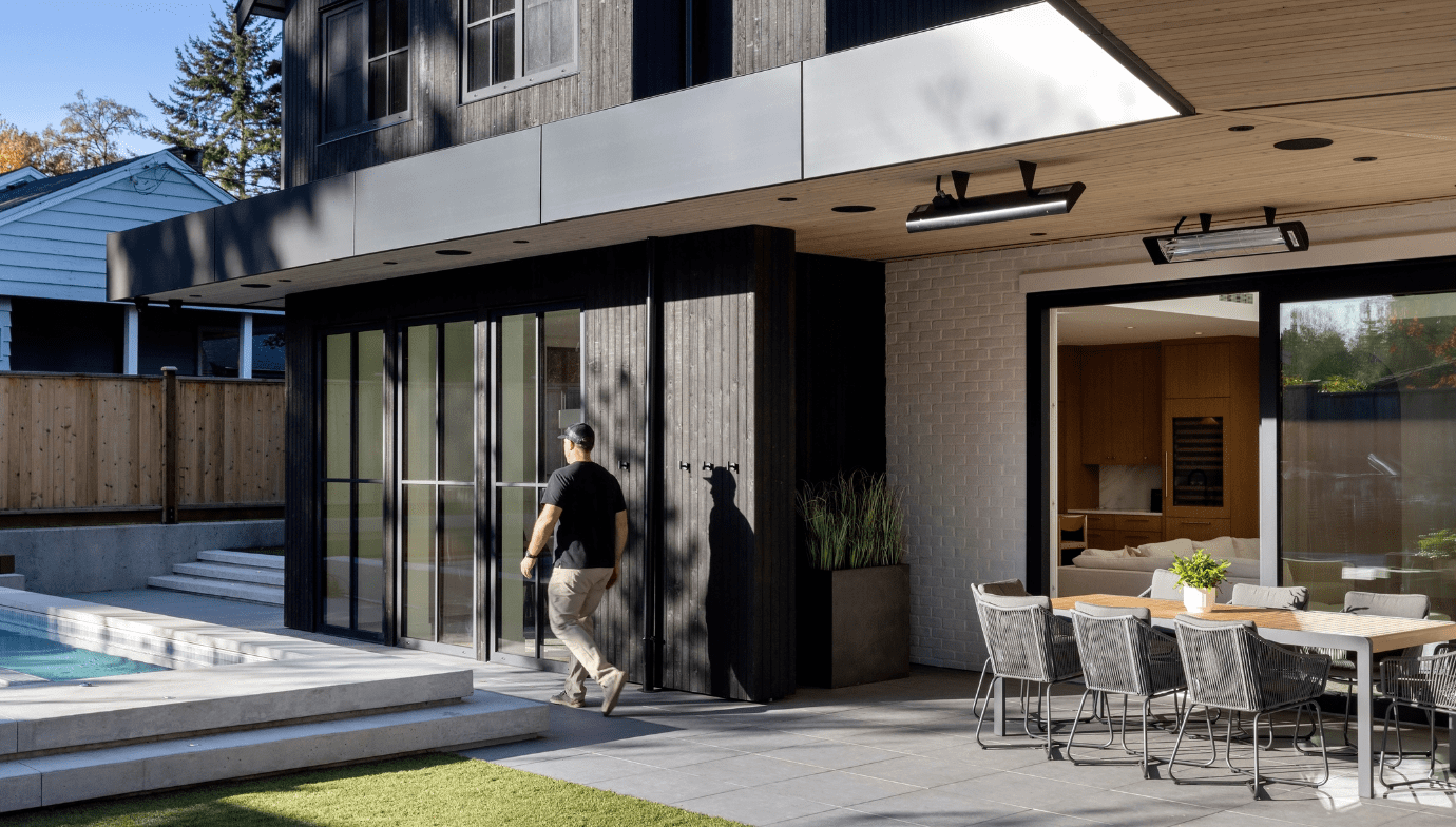 Greg Hasler in backyard by pool at Haven custom home in North Vancouver