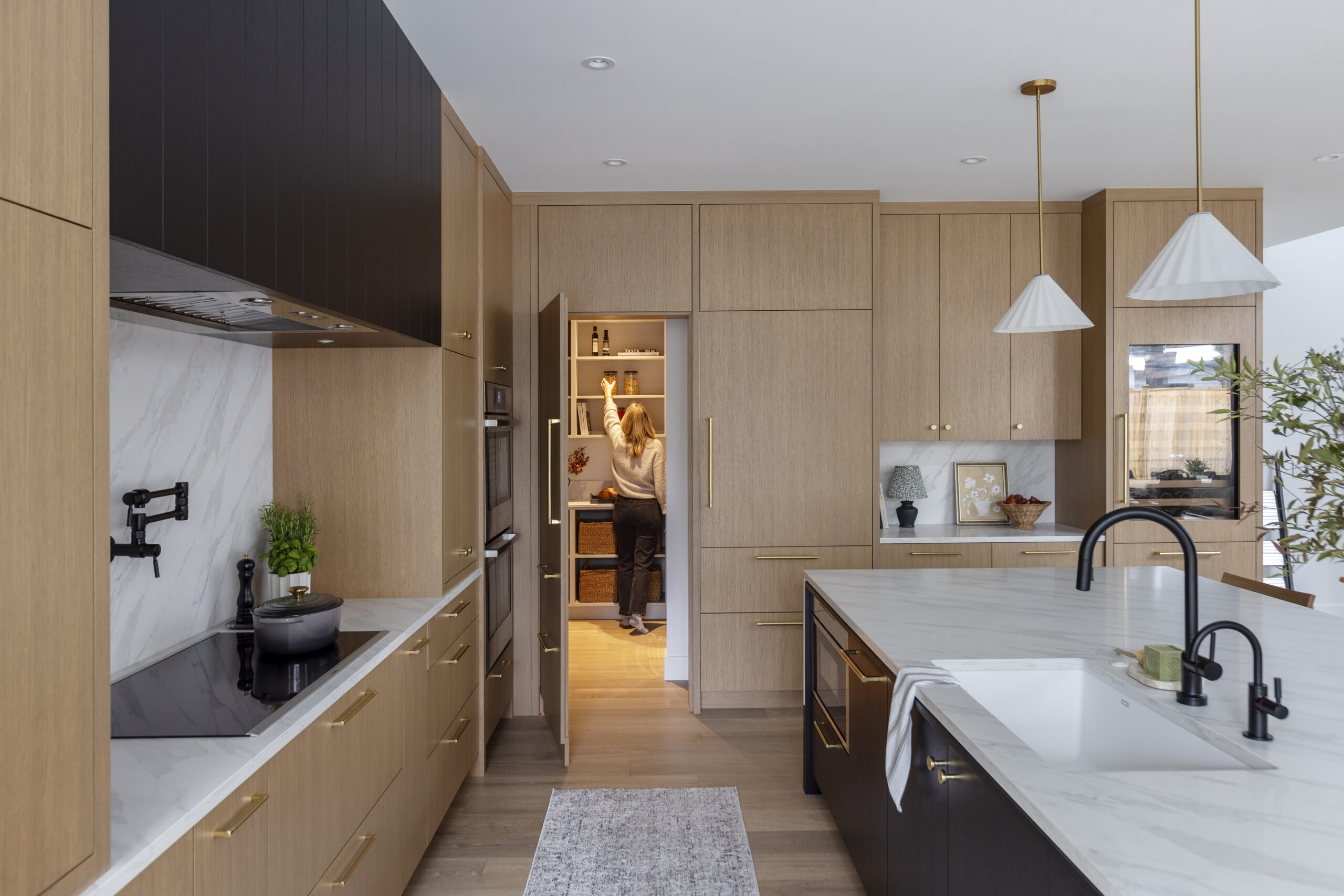 Hidden walk-in pantry custom home feature in Haven (Net Zero Lifestyle) built by Hasler Homes in North Vancouver