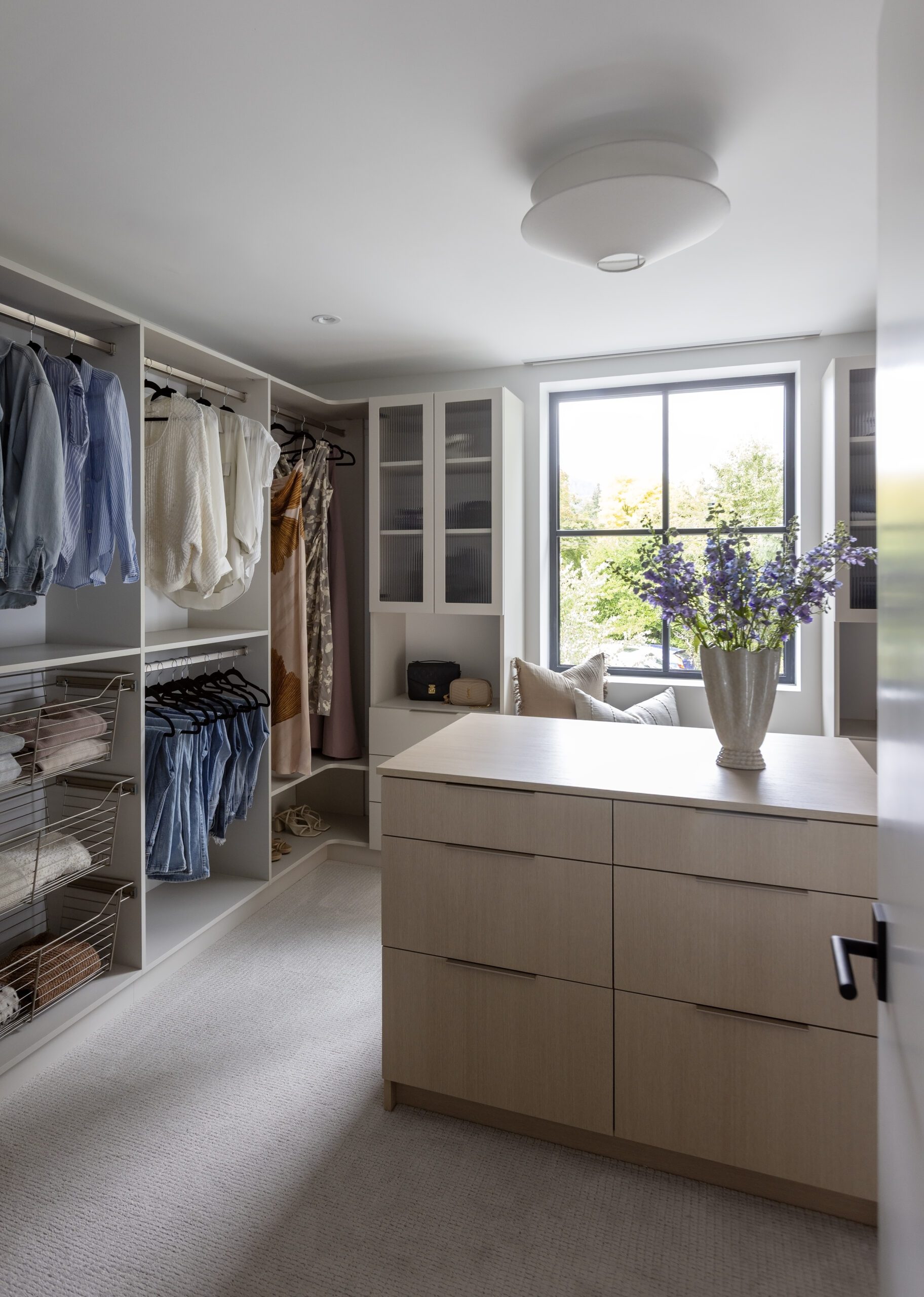 Walk-in closet with custom storage solutions in Haven (Net Zero Lifestyle) project on North Shore