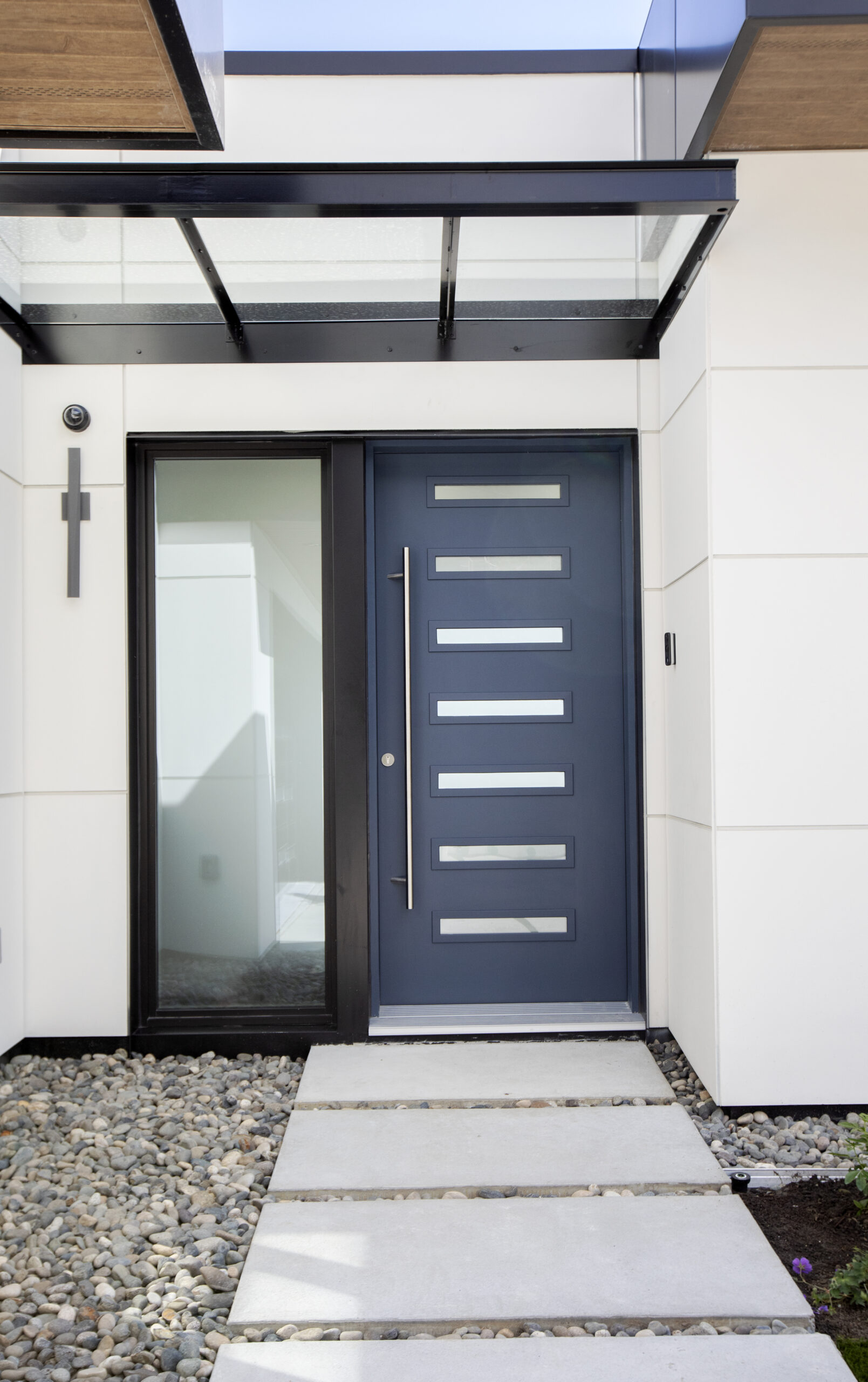 Custom home features at Linda Vista, including front door security camera and smart doorbell