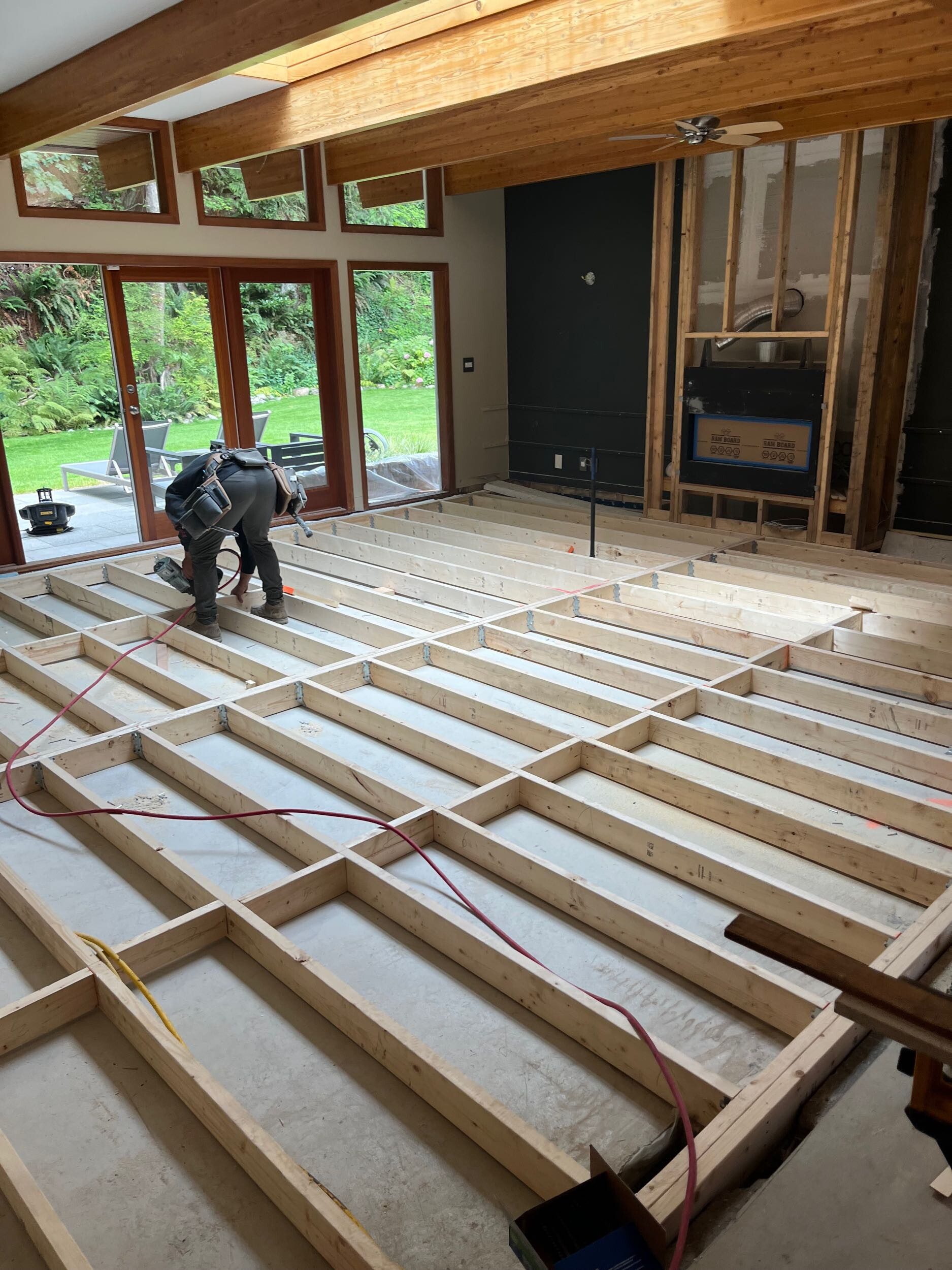 Team Hasler working in the living room at the Pacifica home renovation