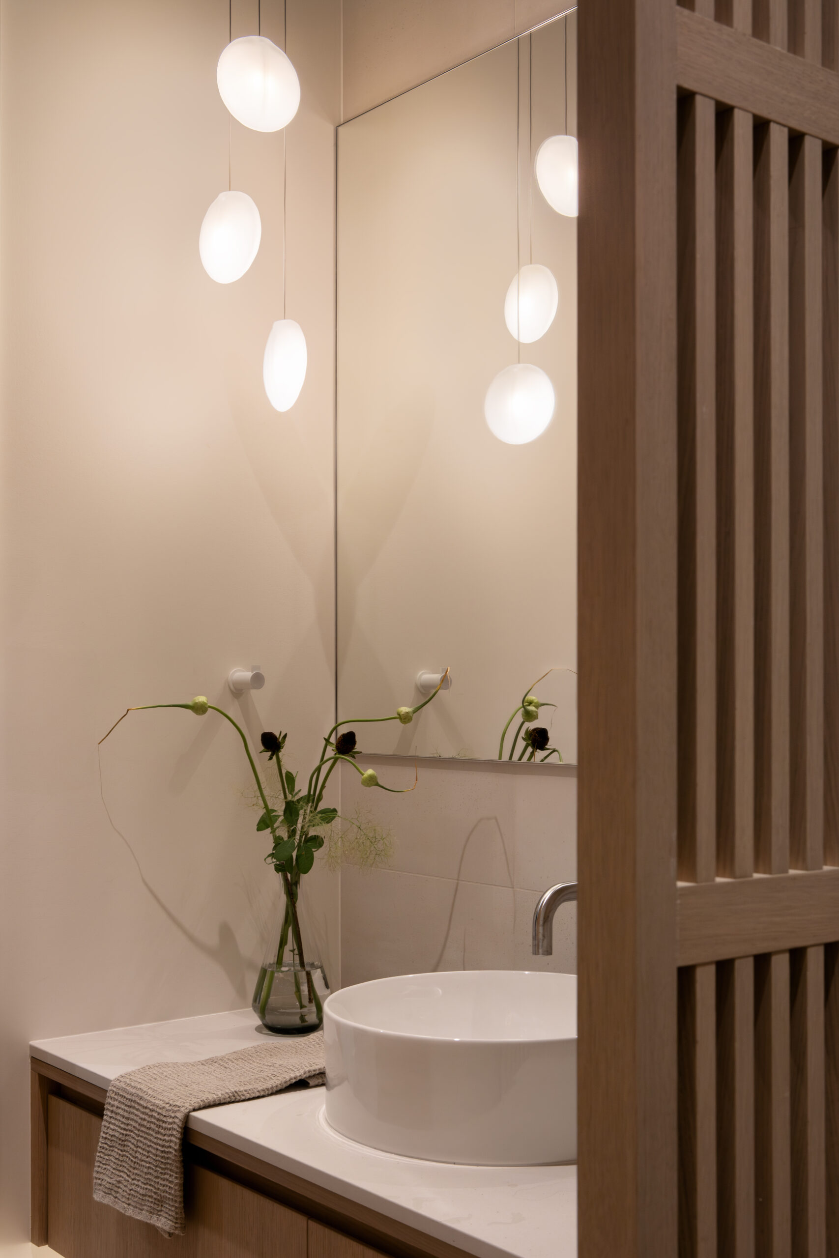 Japandi powder room with Japanese-inspired slatted panels