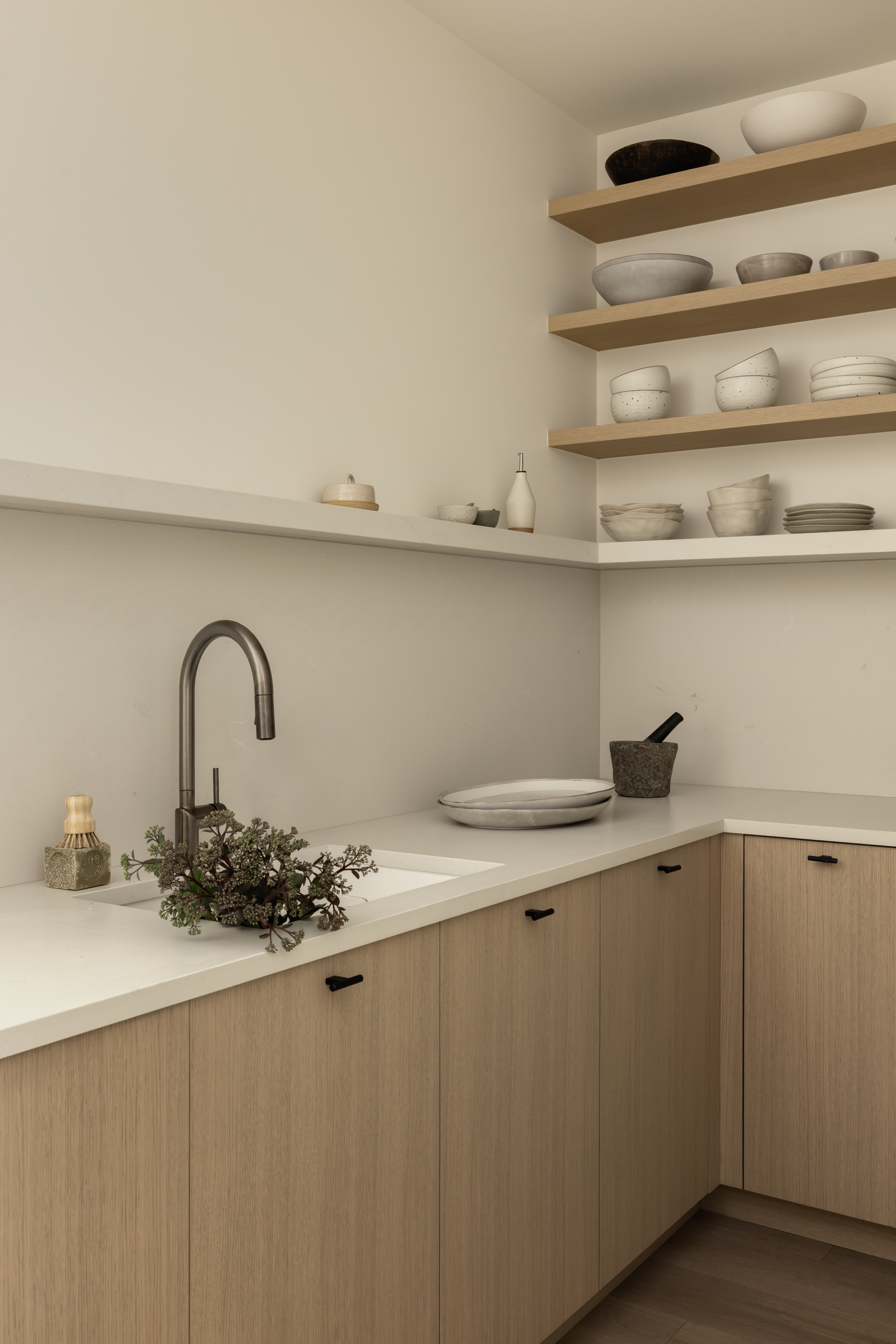 Prep kitchen with sink, dishwasher and built-in storage at Japandia